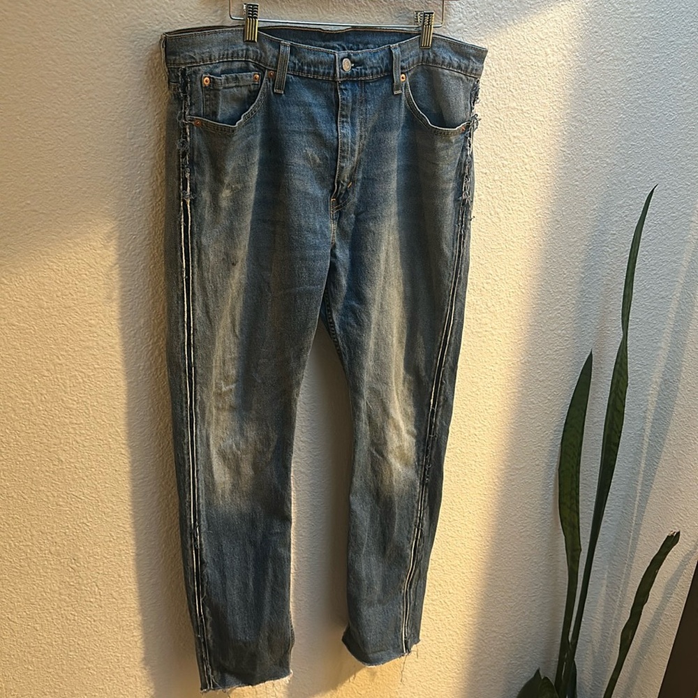 Levis with special distressing on the sides 
W38  L32 
Bottoms hems are cut off